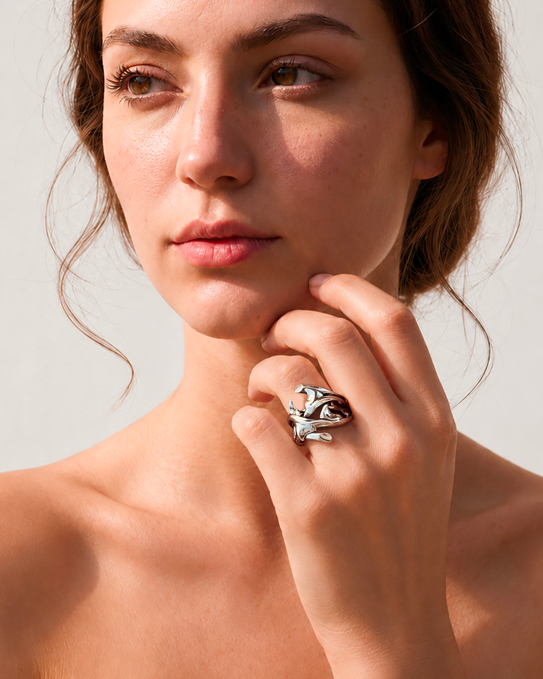 Woman wearing sterling silver Rose Thorn Ring in shiny finish