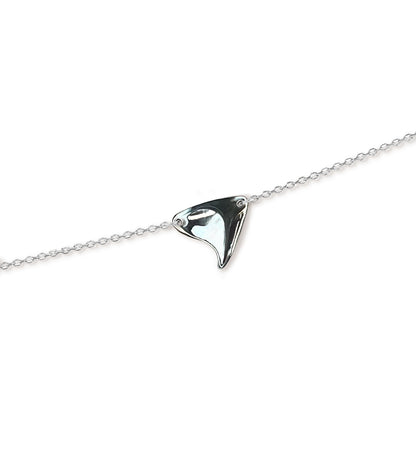 Closeup of a sterling silver rose thorn necklace in a high-shine finish on a white background