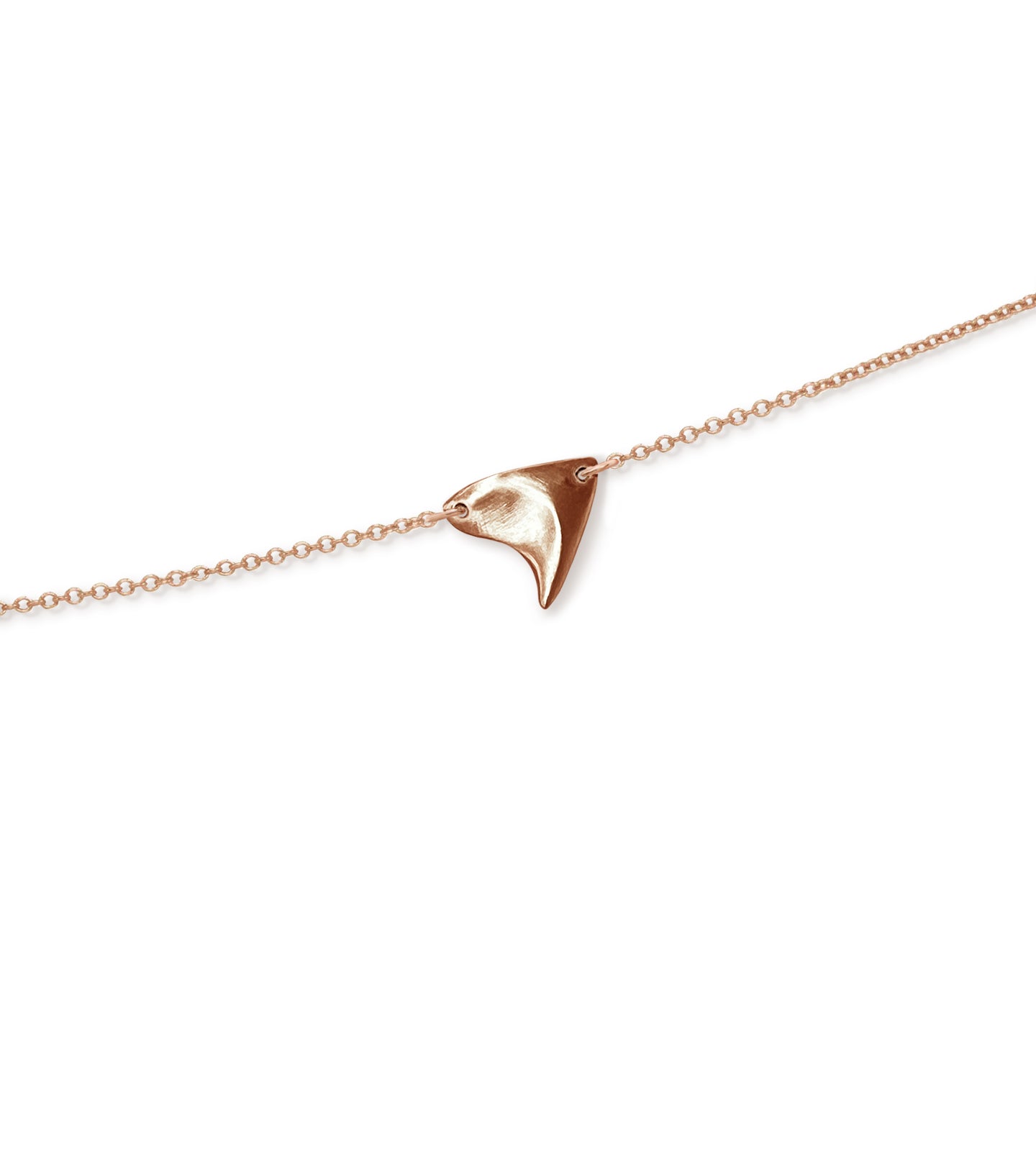 Closeup of brushed finish rose thorn in rose gold, on rose gold chain