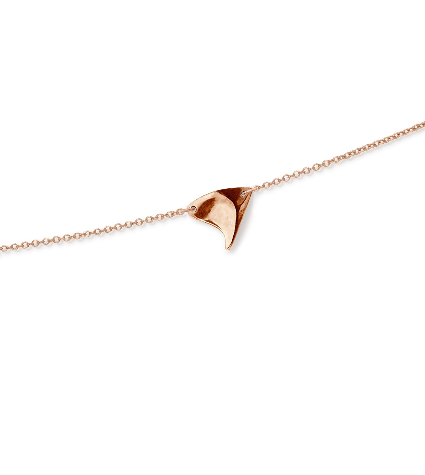Closeup of shiny finish rose thorn in rose gold, on rose gold chain