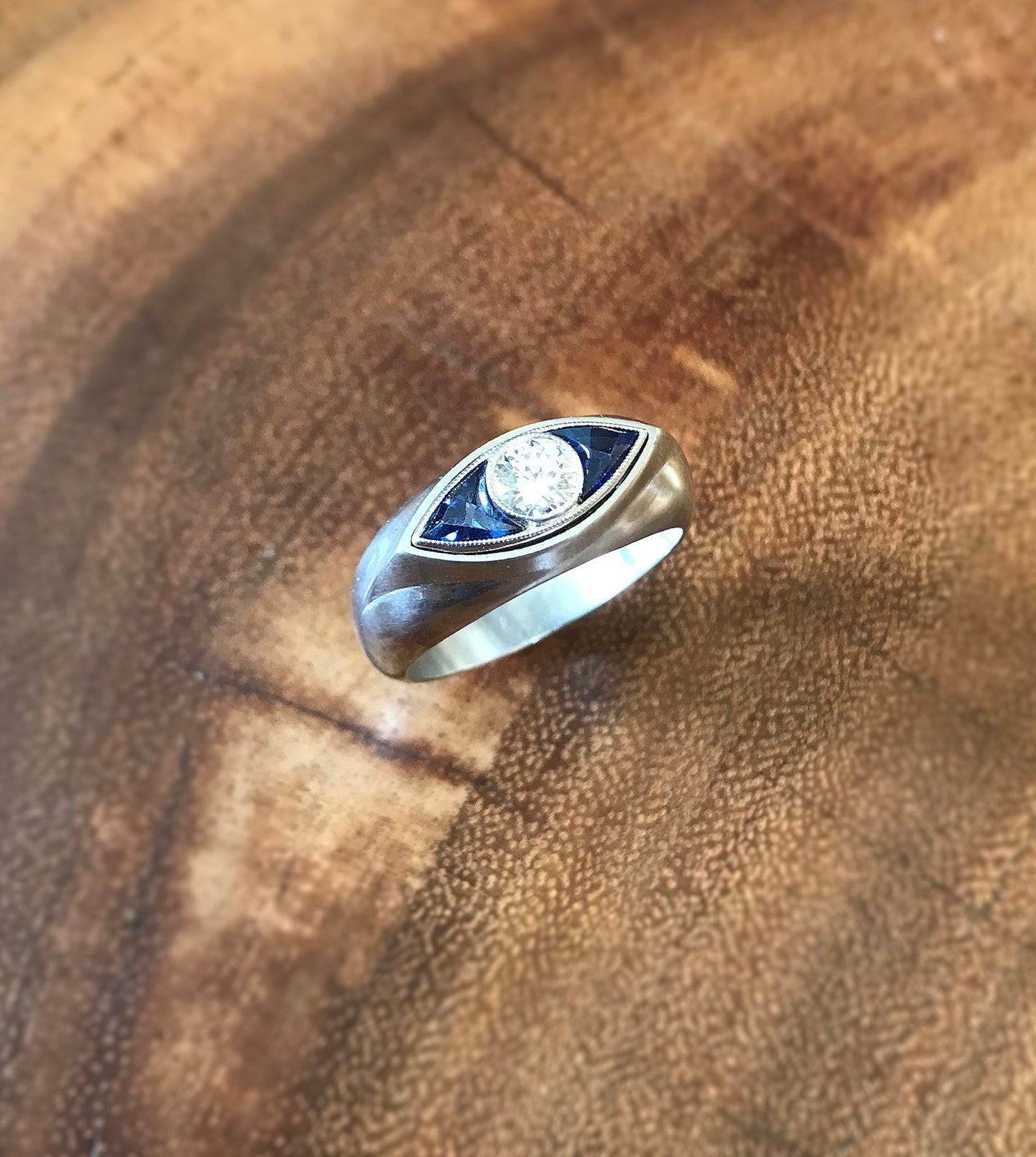 Sapphire and diamond eye signet ring in platinum, alternate angle