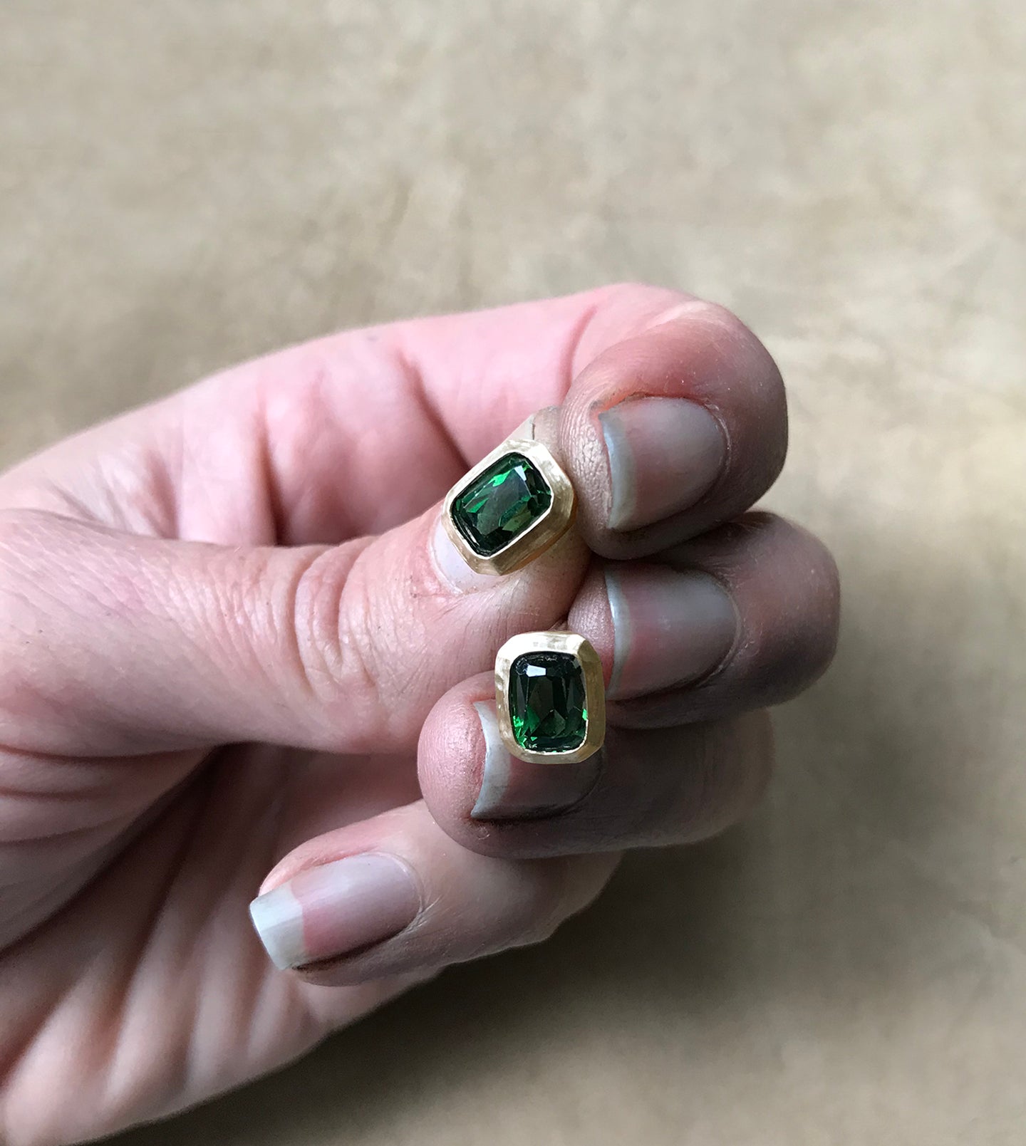 Pair of repurposed tourmaline gold stud earrings with hand-carved hammered bezels