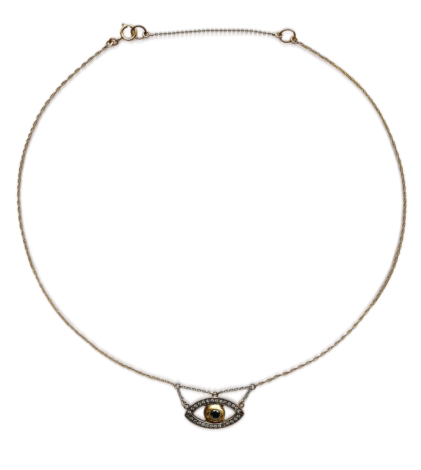 Evil eye necklace on a neutral background, gold iris with pavé white gold outline on a fine gold chain