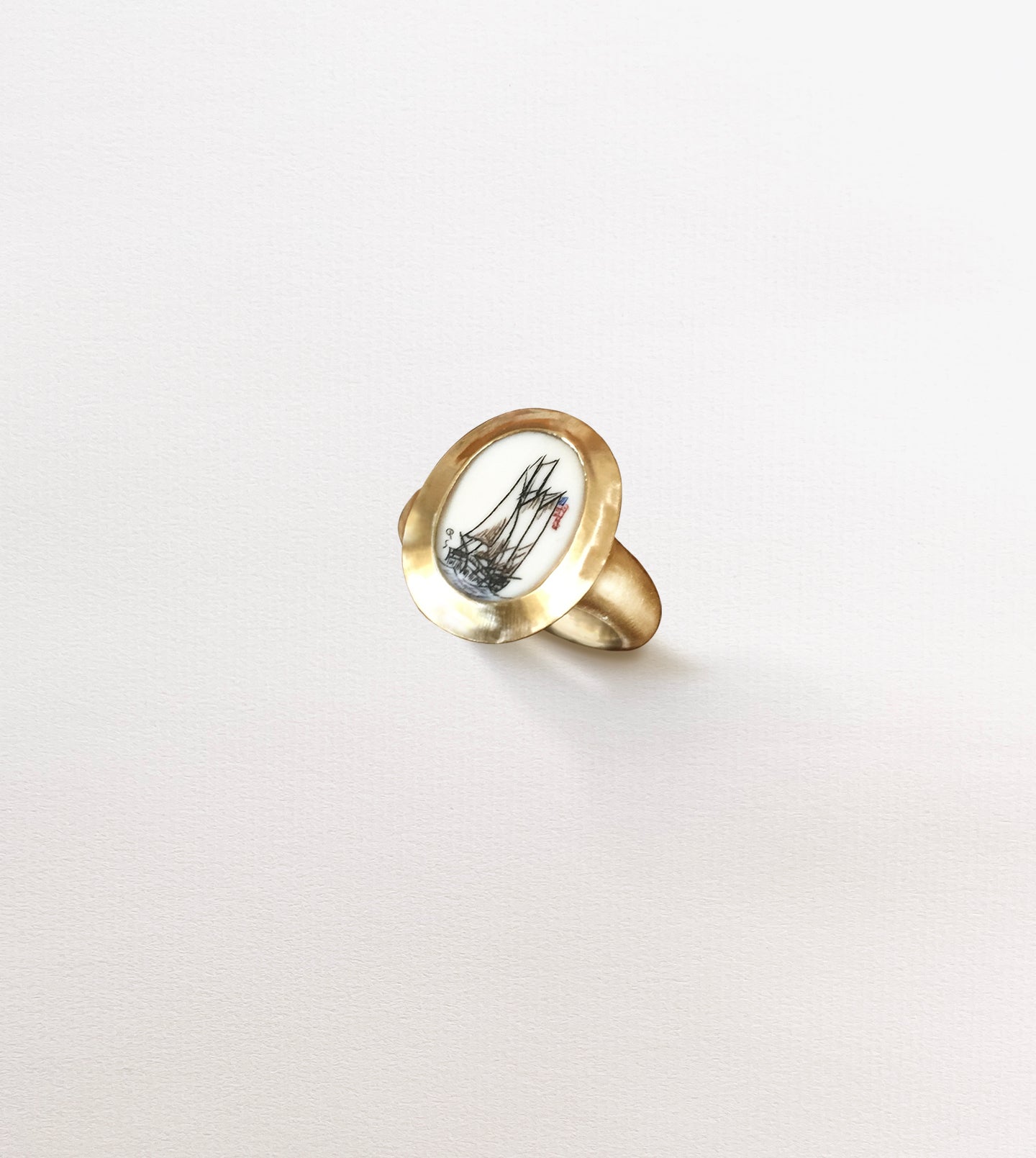 Modern scrimshaw ring, alternate view of the carved ship scrimshaw in a gold picture-frame bezel