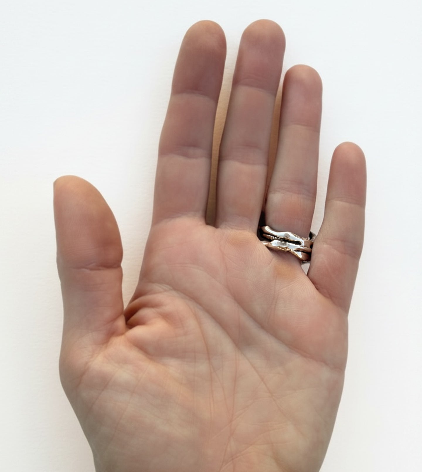 Handmade sterling silver thorn ring in polished finish, showing the back of the ring on hand