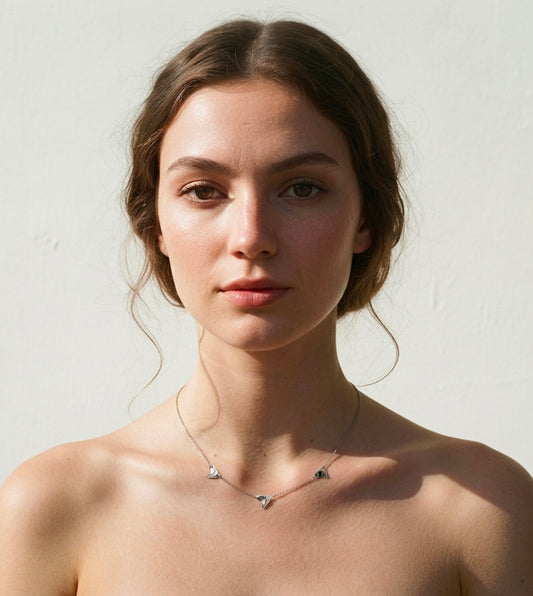 Triple Rose Thorn Necklace in Shiny Finish  worn on model's neck