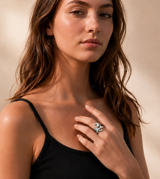Woman wearing sterling silver rose thorn ring