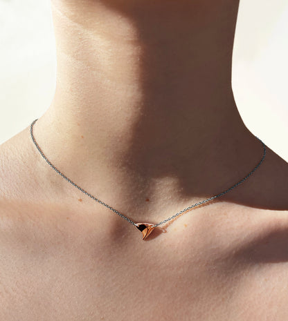 Shiny finish rose gold rose thorn necklace with sterling silver chain on model