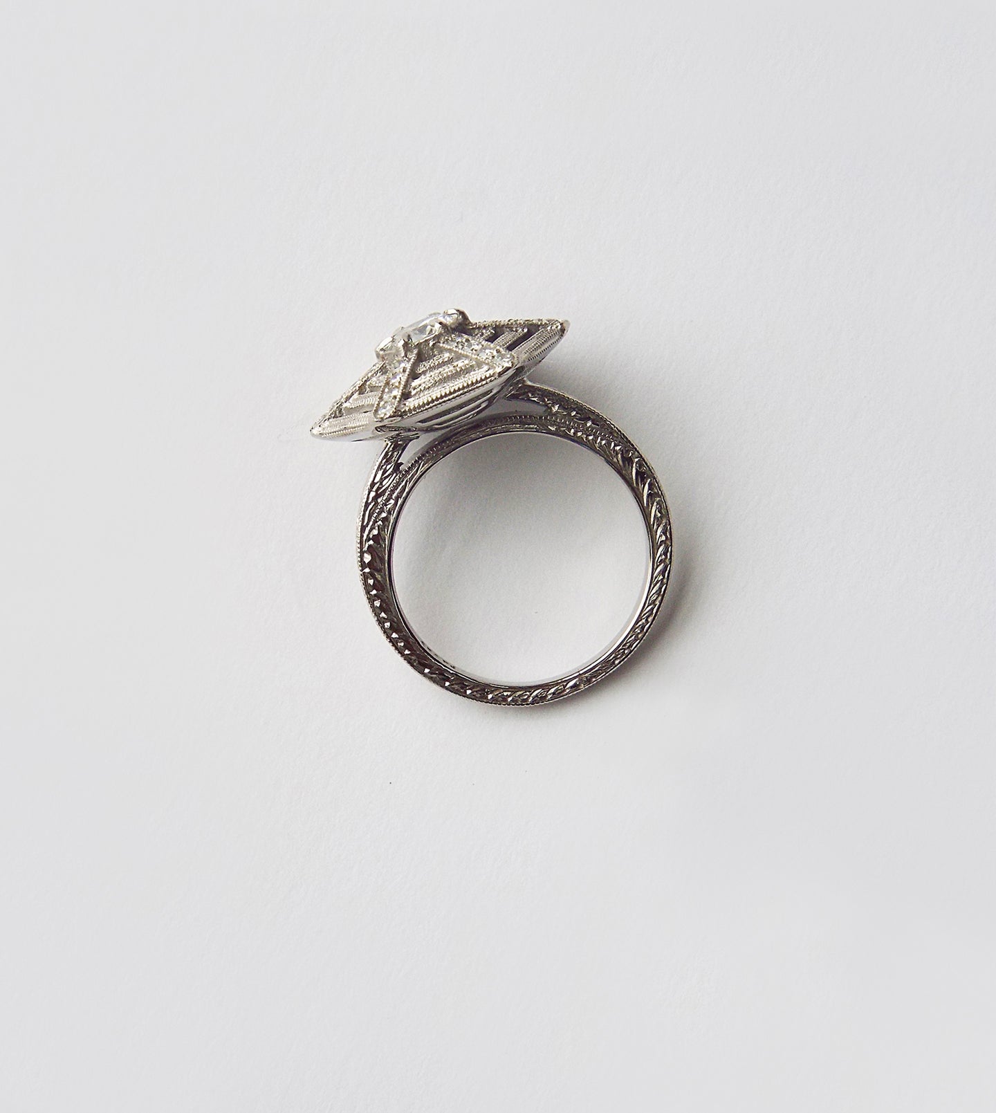 Close-up of the spiderweb ring central diamond and gossamer diamond web