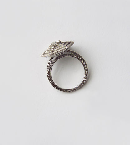 Close-up of the spiderweb ring central diamond and gossamer diamond web