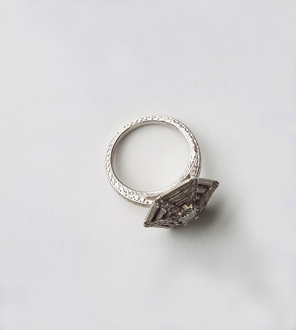 Spiderweb diamond engagement ring, side view showing the hand-engraved shank