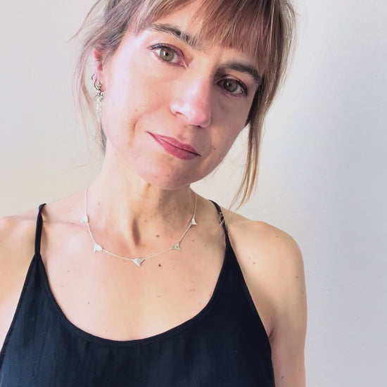 The sterling silver 5-thorn necklace as worn on the jeweler