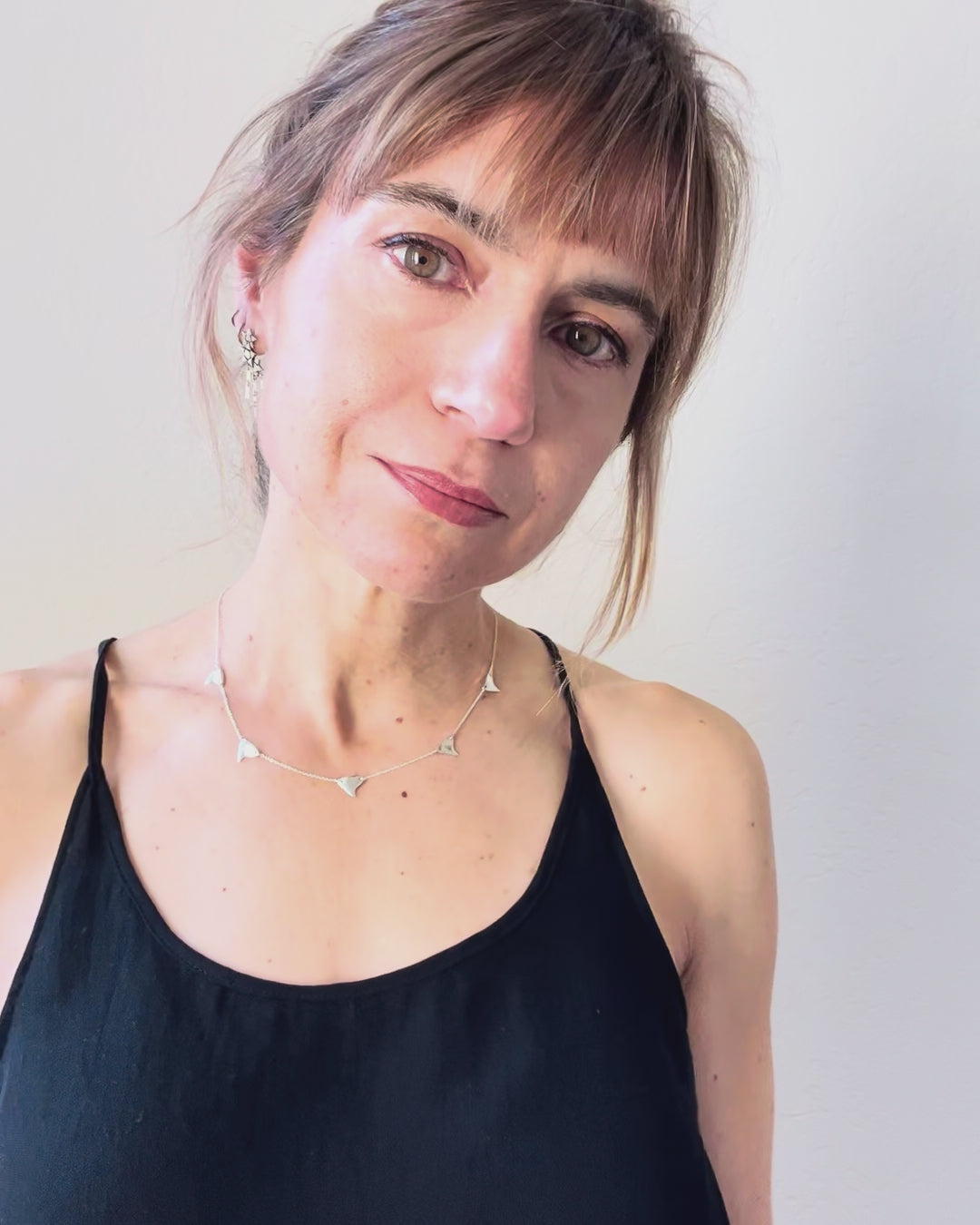 The sterling silver 5-thorn necklace as worn on the jeweler