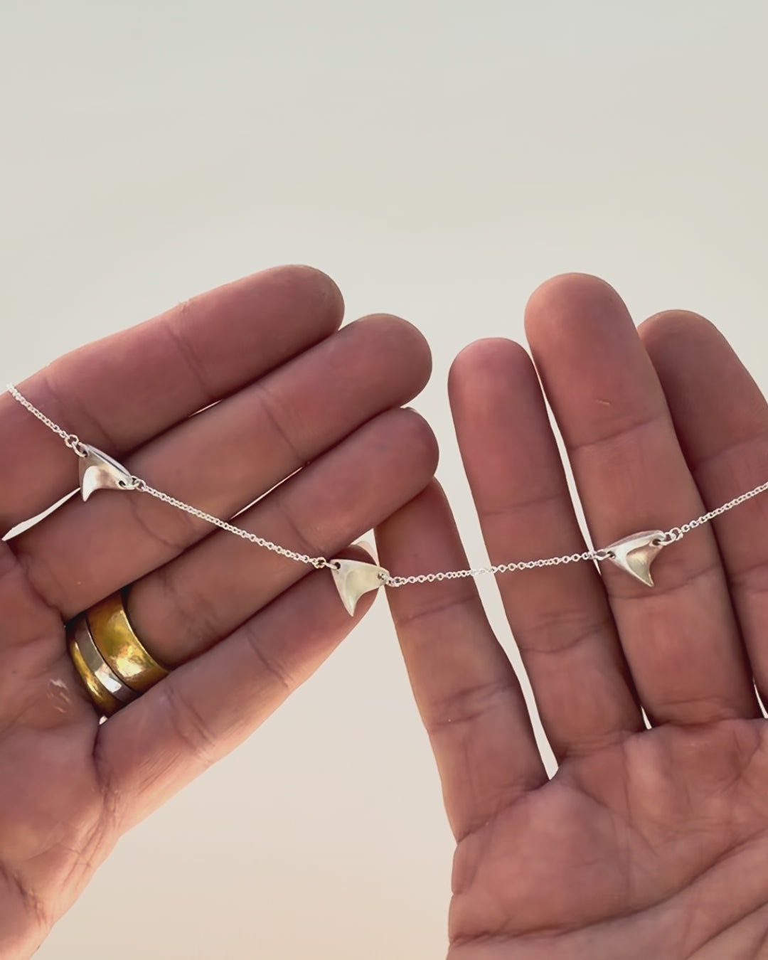 Jeweler making the sterling silver three-thorn necklace